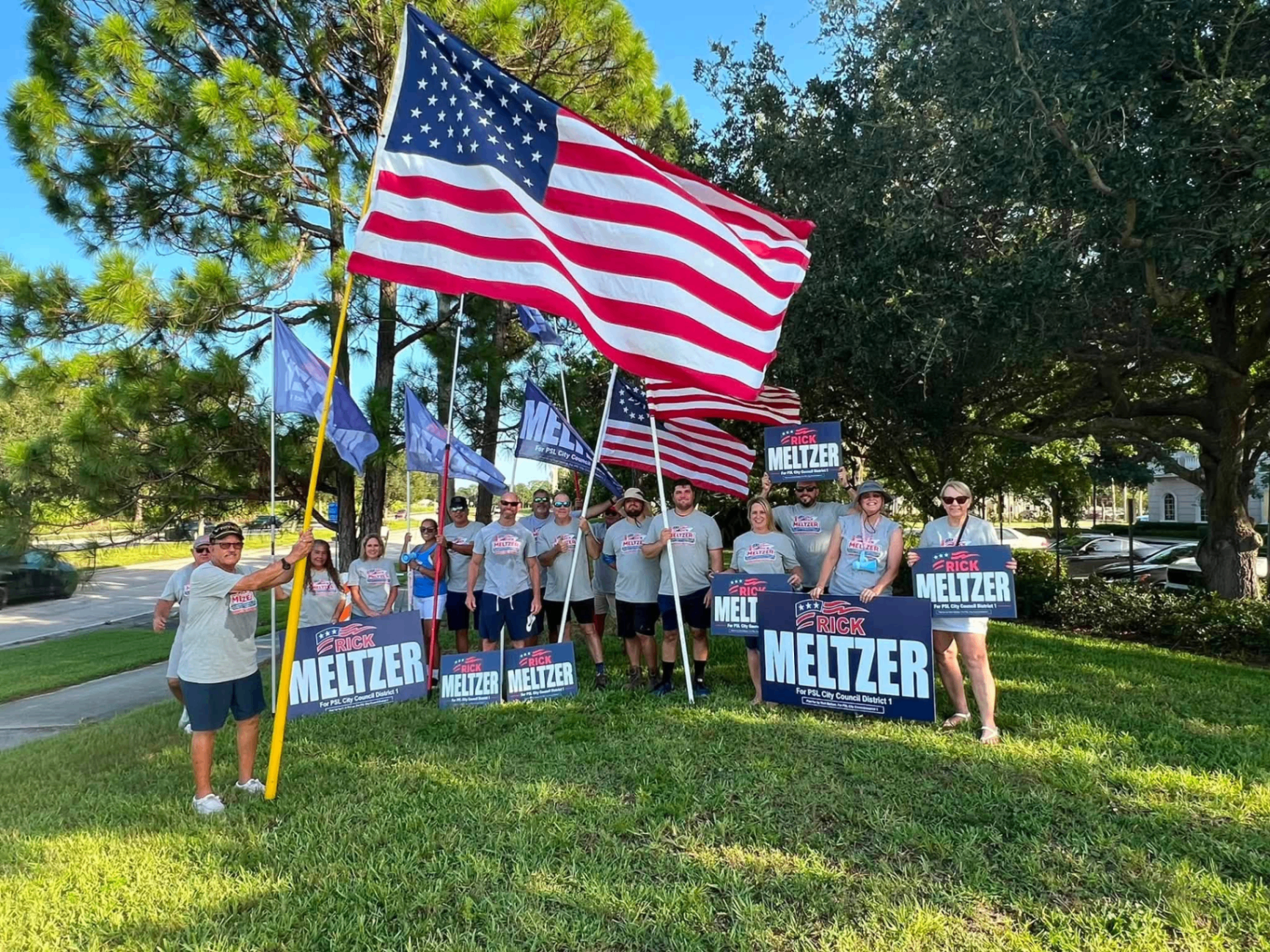 Rick Meltzer supporters waving signs and American flags